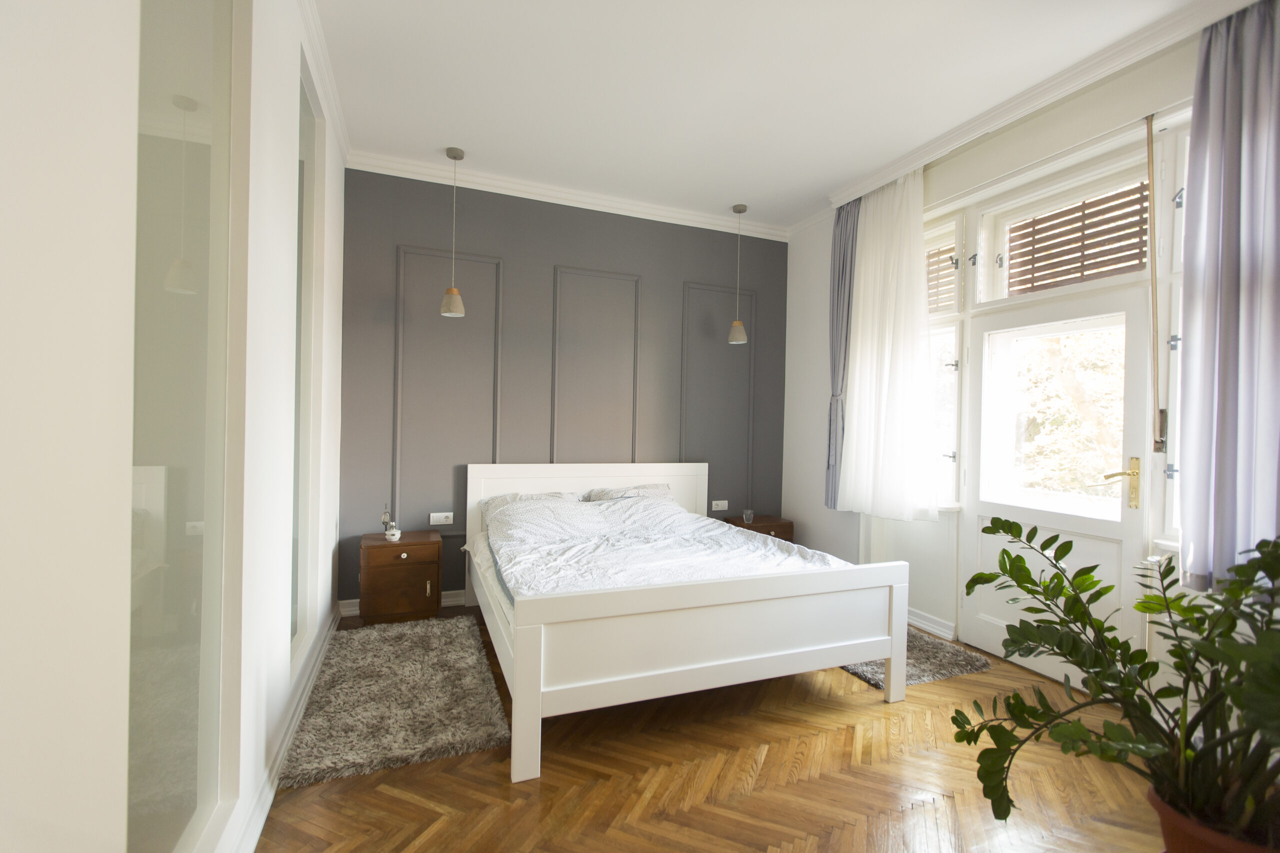 Interior of white and gray cozy bedroom in the house